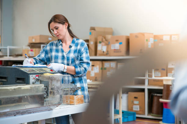 istock Woman doing the inventory at a warehouse 1047341668