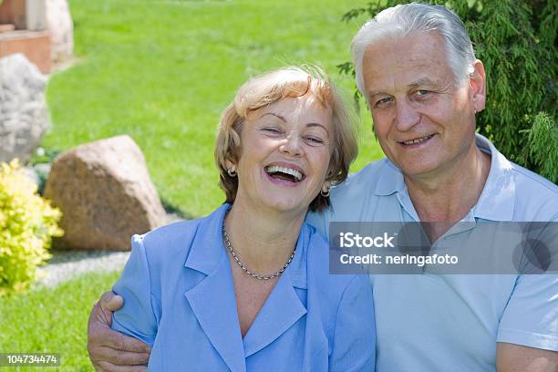 Smiling Senior Couple In The Backyard Stock Photo - Download Image Now - 60-69 Years, 70-79 Years, Active Seniors