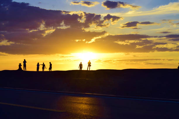 istock Silhouette of People in the Desert during Sunset 1047356400