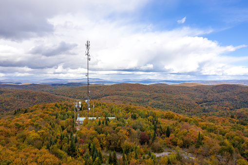 AERIAL Fall colors of a forest in Autumn Season and Cellular Antenna
