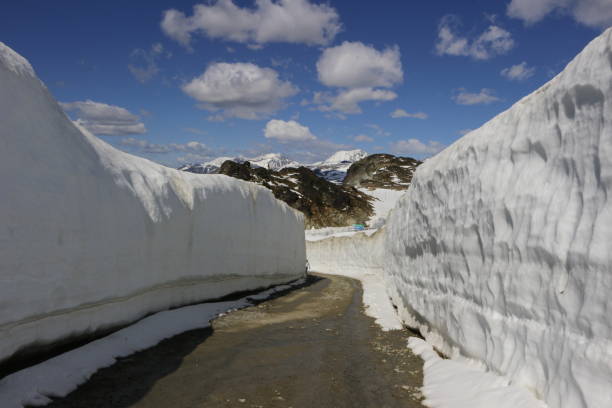 istock Hiking through massive snow walls - Stock image 1047364534