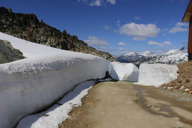 istock Hiking through massive snow walls - Stock image 1047364538