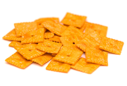 Crackers placed on top of each other on a white background. Viewed from above.