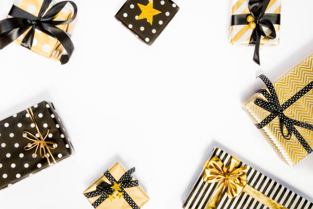 istock Top view of gift boxes in various black, white and golden designs. Flat lay, copy space. A concept of Christmas, New Year, birthday celebration event. 1047374744