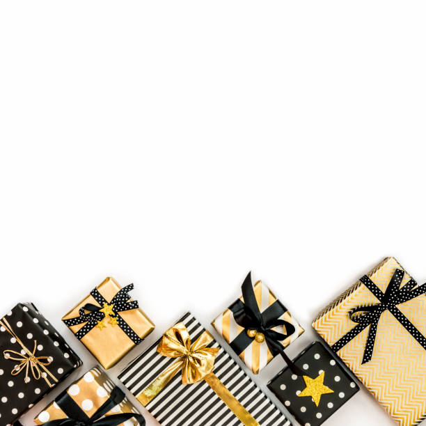 istock Top view of gift boxes in various black, white and golden designs. Flat lay, copy space. A concept of Christmas, New Year, birthday celebration event. 1047374766