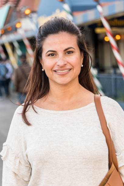 istock Smiling mature woman posing looking at the camera 1047377792