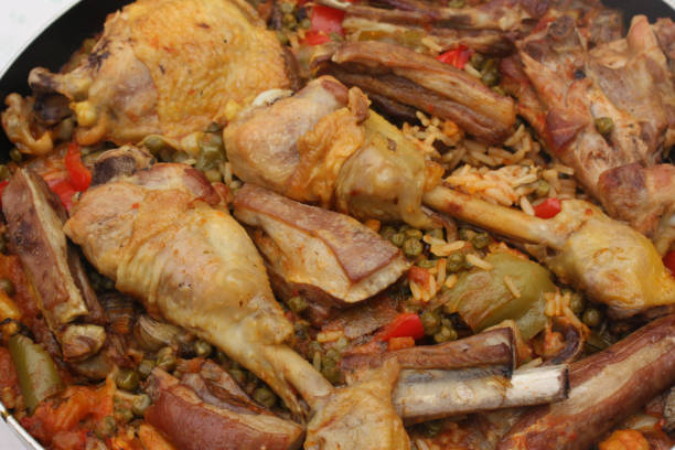 istock Paella with chicken lamb meat and seafood 1047383292