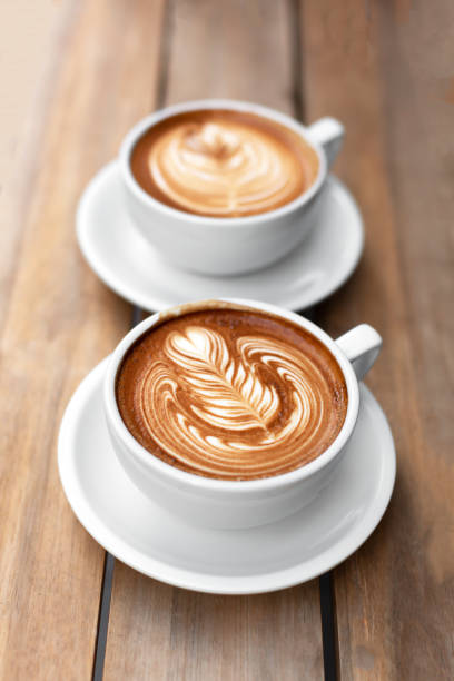 istock Two cups of cappuccino with latte art 1047386304
