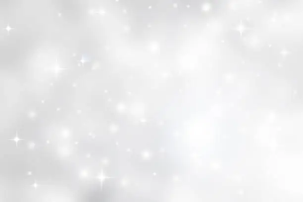 Photo of Abstract blurred soft white and gray silver beautiful glowing blinking bokeh and snowfall and star on colorful background for merry christmas and happy new year design banner  and presentation concept