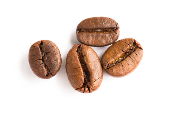 istock Brown coffee beans isolated on white background 1047390710