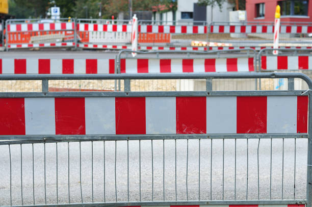 istock metal fences in rows at construction site 1047393316