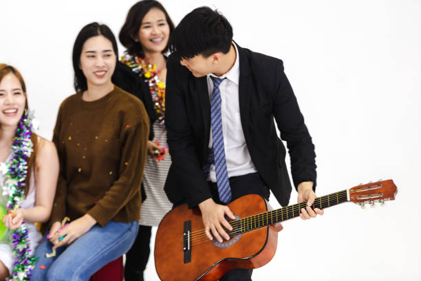 istock young men show playing guitar 1047395648