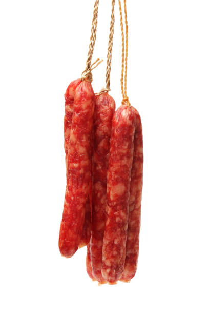 istock Salami sausages on the white background 1047401866