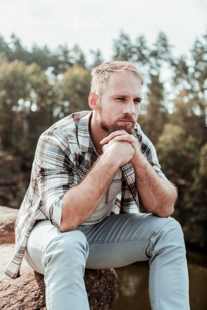 istock Dark-eyed man feeling a little bit melancholic after break up with girlfriend 1047407254