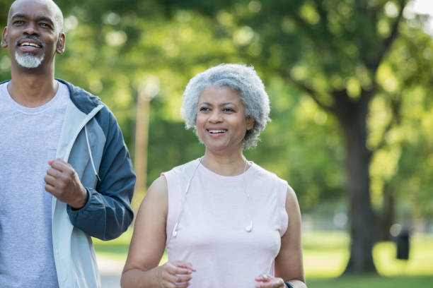 istock Happy African American woman jogs with her husband 1047407442