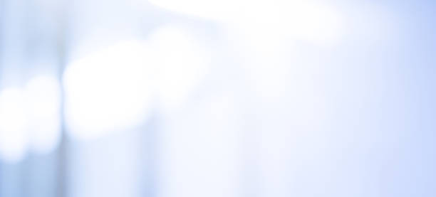 istock abstract blur contemporary office interior as blue ,silver and grey color gradient in horizon panoramic with flash light background for design as banner , ads ,presentation concept 1047407740