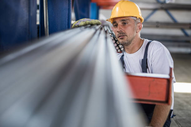 istock Mid adult steel worker analyzing iron in a factory. 1047421692