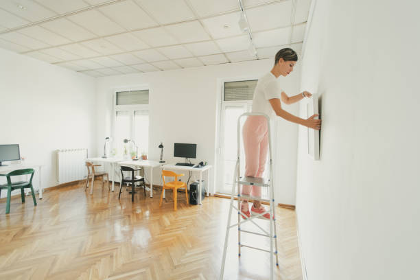 istock Woman looking behind the picture 1047428148