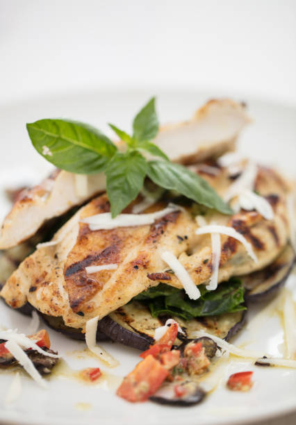 istock italian styled chicken on white background 1047430454