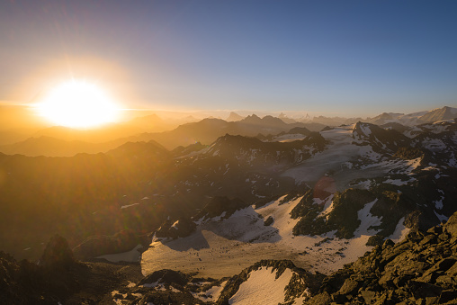 A beautiful sunrise from the summit of a mountain in the Valais region of Switzerland.
