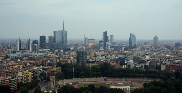 Milan Porta Nuova financial district skyline viewed from Torre Branca, an iron panoramic tower located in Parco Sempione, the main city park of Milan. It is 108.6 m high, and was inaugurated in 1933. 
Porta Nuova it is now one of Italy's most high-tech and international districts, containing some of the country's tallest skyscrapers.
Lombardy, Italy