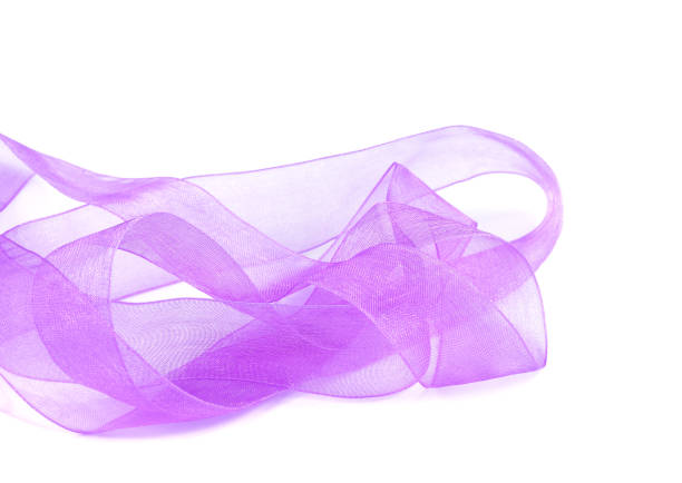 istock Beautiful violet silk ribbon isolated on white background 1047430946