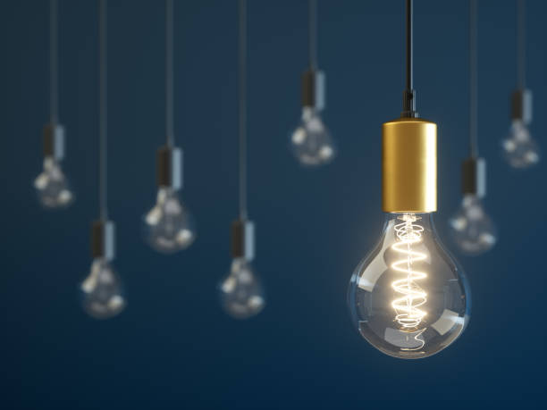 istock Light bulb lamps on a blue background 1047430972