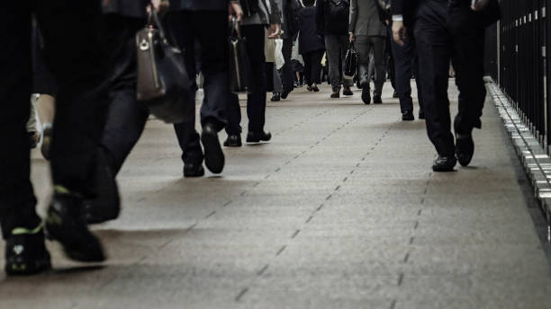 istock Crowd of commuters on their way to work in Tokyo 1047433780