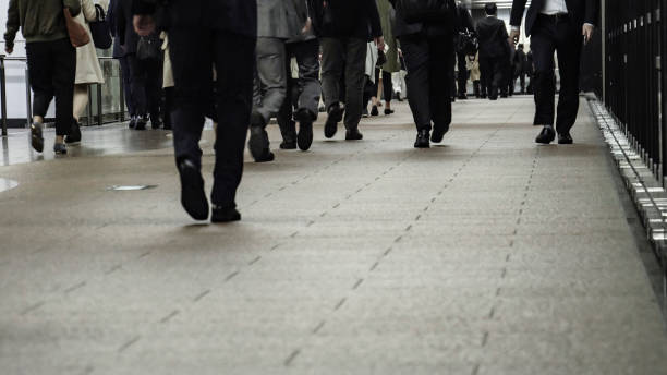 istock Crowd of commuters on their way to work in Tokyo 1047433792