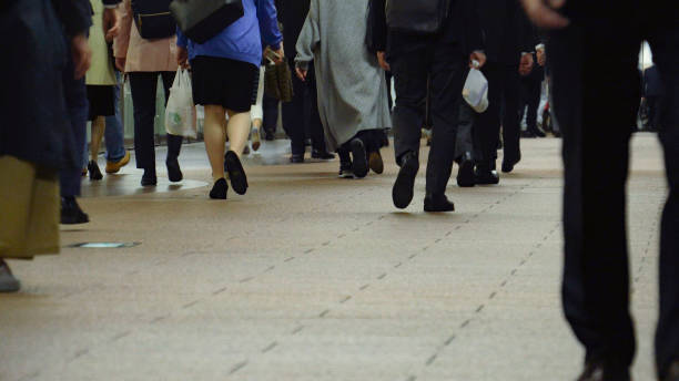 istock Crowd of commuters on their way to work in Tokyo 1047433794