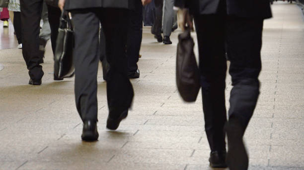 istock Crowd of commuters on their way to work in Tokyo 1047433820