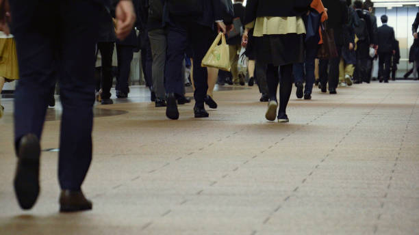 istock Crowd of commuters on their way to work in Tokyo 1047433826