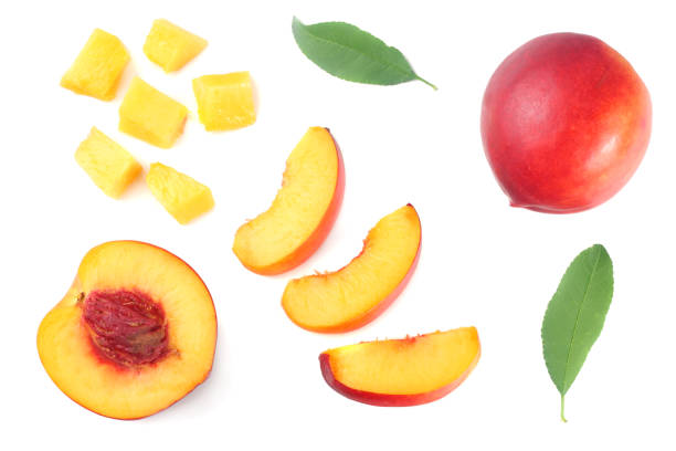 nectarine with green leaf and slices isolated on white background. top view - nectarine imagens e fotografias de stock