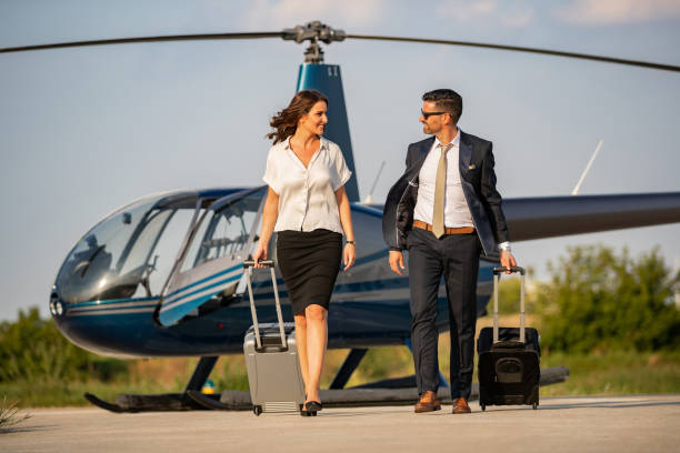 istock Happy passengers after flight in helicopter 1047437142