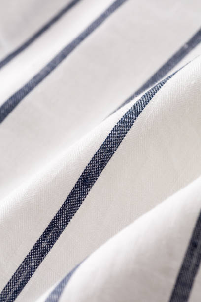 istock White linen fabric with navy stripes 1047439912