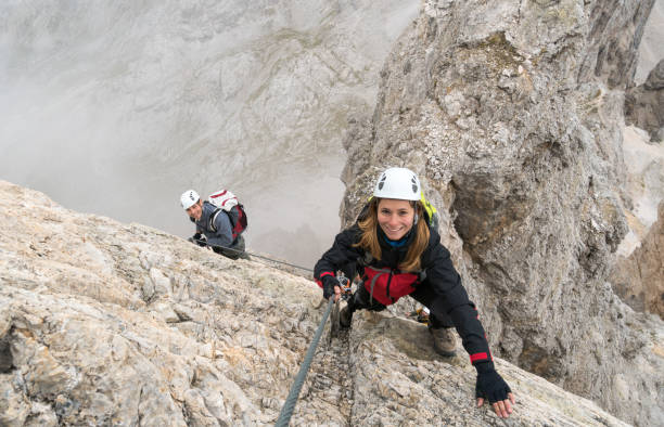 istock young climbers on a steep and exposed rock face climbing a Via Ferrata 1047443090