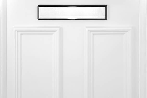 istock Black and white mail slot on a white door 104744771