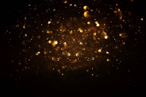 istock glitter vintage lights background. black and gold. de-focused. 1047460066