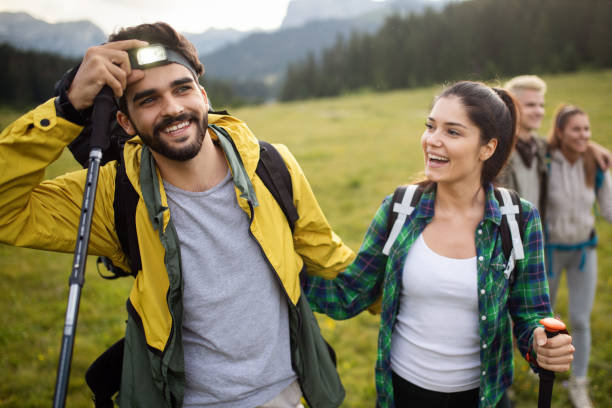 istock Backpackers happy young couple hiking with sticks 1047460914