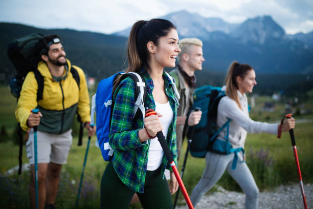 istock Group of hikers walking on a mountain and smiling 1047461016