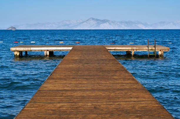 Wooden pier in the Aegean Sea in the resort of Turkey. Exit to the sea in the resort area of Turgutsreis, Bodrum.