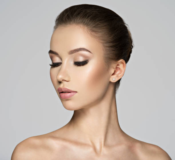 istock beautiful young woman - profile view. 1047472468