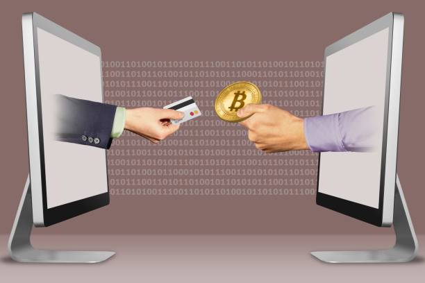 istock e-commerce concept, two hands from laptops. hand with credit card and hand with bitcoin. 3d illustration 1047475048