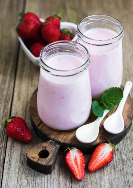 istock Jars with strawberry yogurt 1047479528