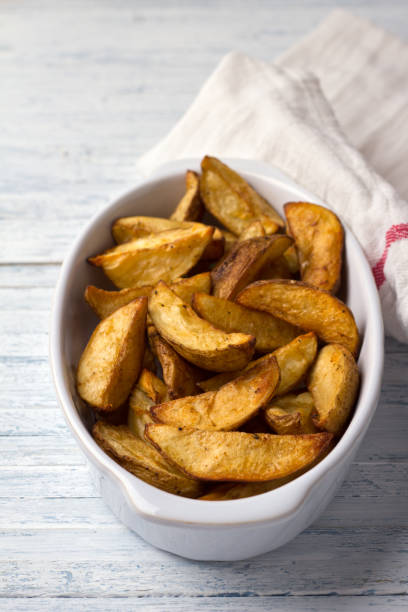 istock Baked potatoes on a light blue background 1047482930
