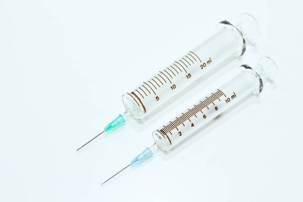 10 and 20 ml syringe with needle isolated on the white background