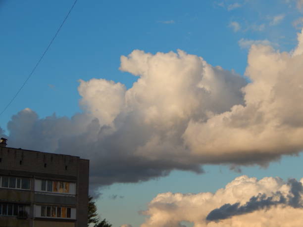 istock Clouds of a storm over the city float 1047490704
