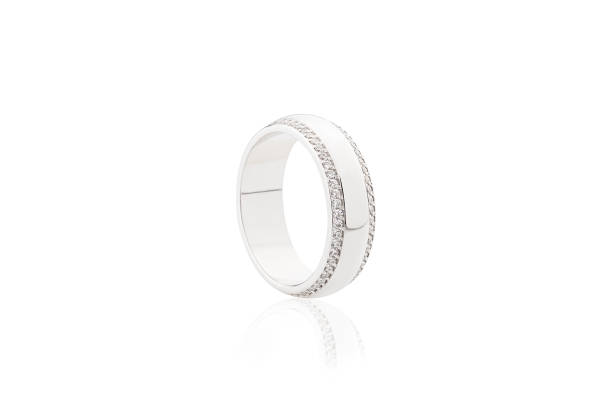 istock Silver wedding ring with diamonds isolated on white background 1047494866