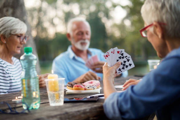 istock Senior people playing cards game 1047498562