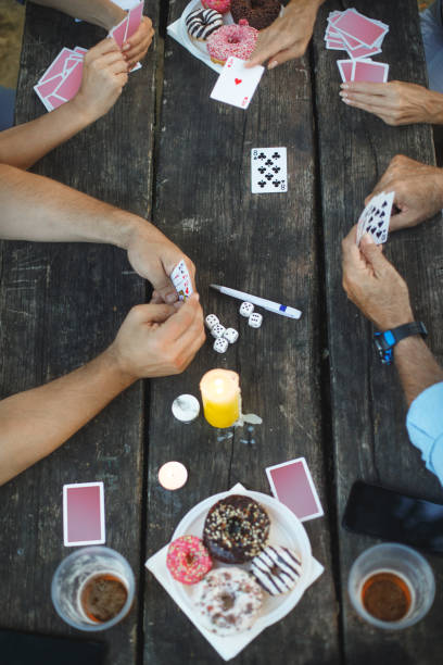istock Senior people playing cards game 1047498704